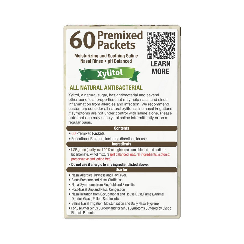 A rectangular product information card for Xylitol 60 Premixed Packets nasal rinse, with a cream background, dark brown text, a green banner, a QR code, and usage/contents details.