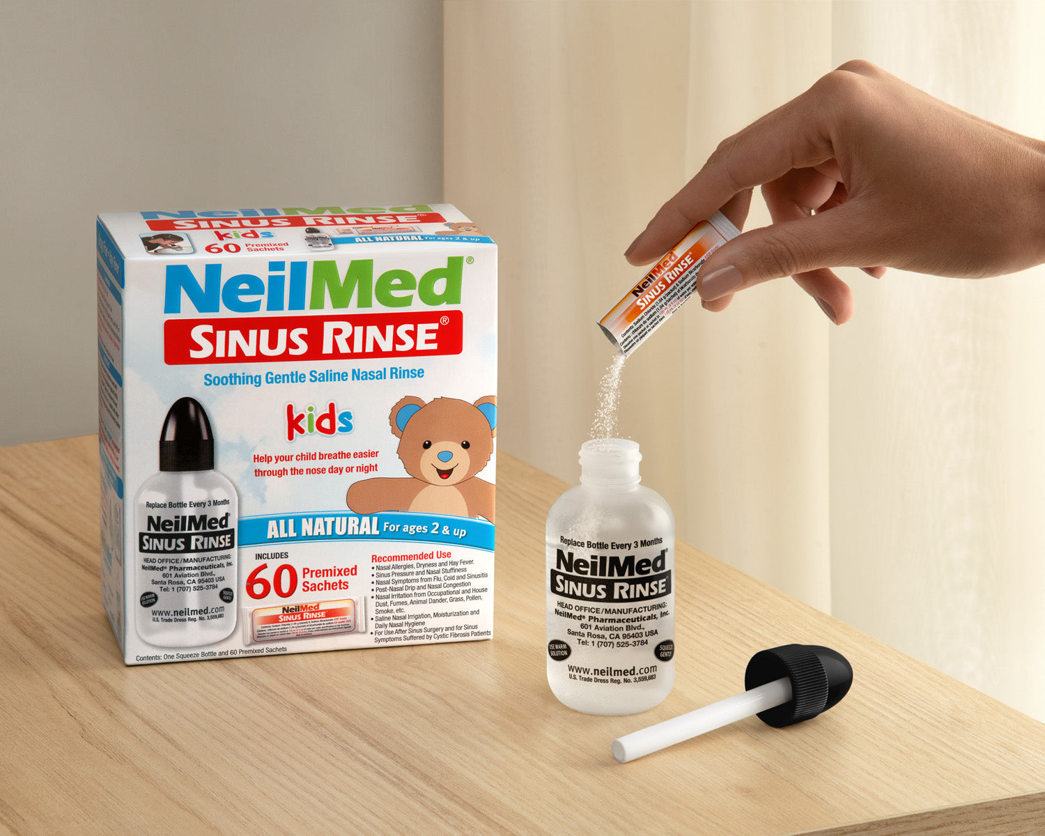 NeilMed Sinus Rinse product packaging and usage on a wooden surface.