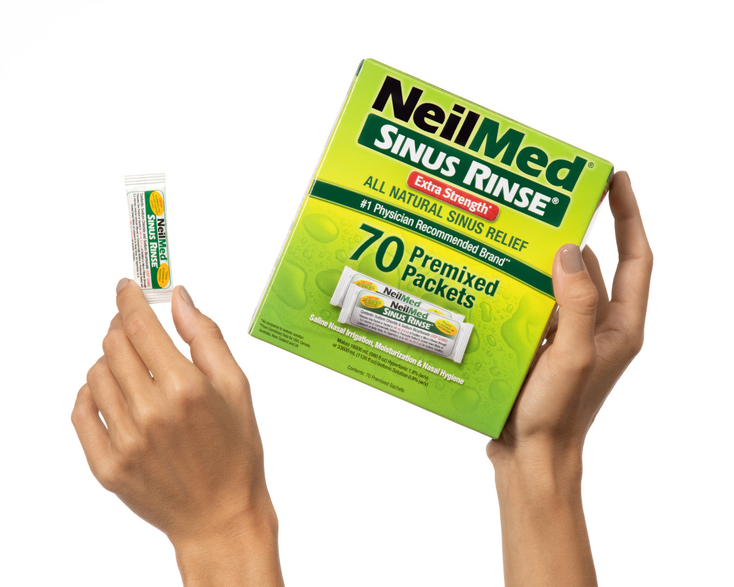 NeilMed Sinus Rinse packets held by hands on a white background