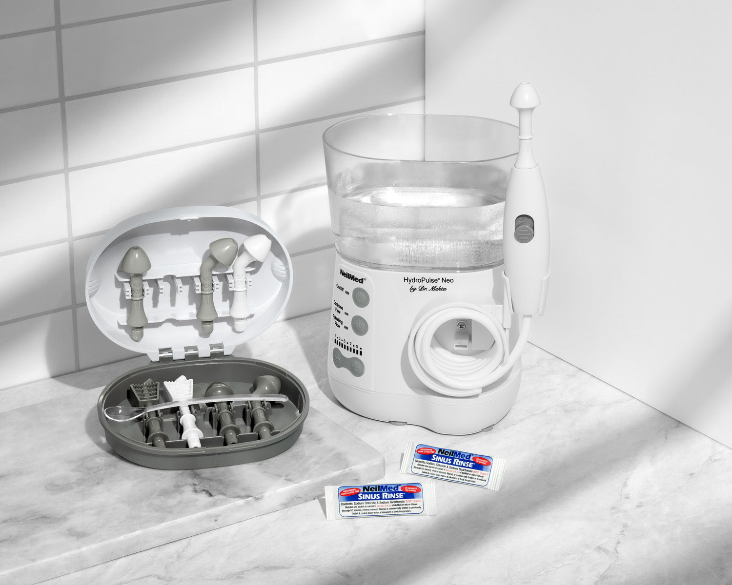 HydroPulse Neo with accessories on a tiled bathroom floor