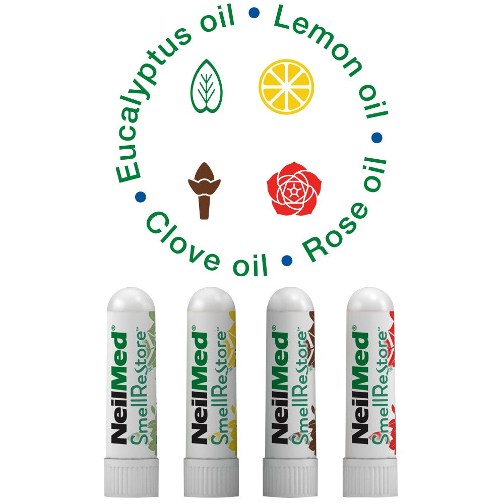 Four nasal inhalers with different essential oils: Eucalyptus, Lemon, Rose, and Clove on a white background